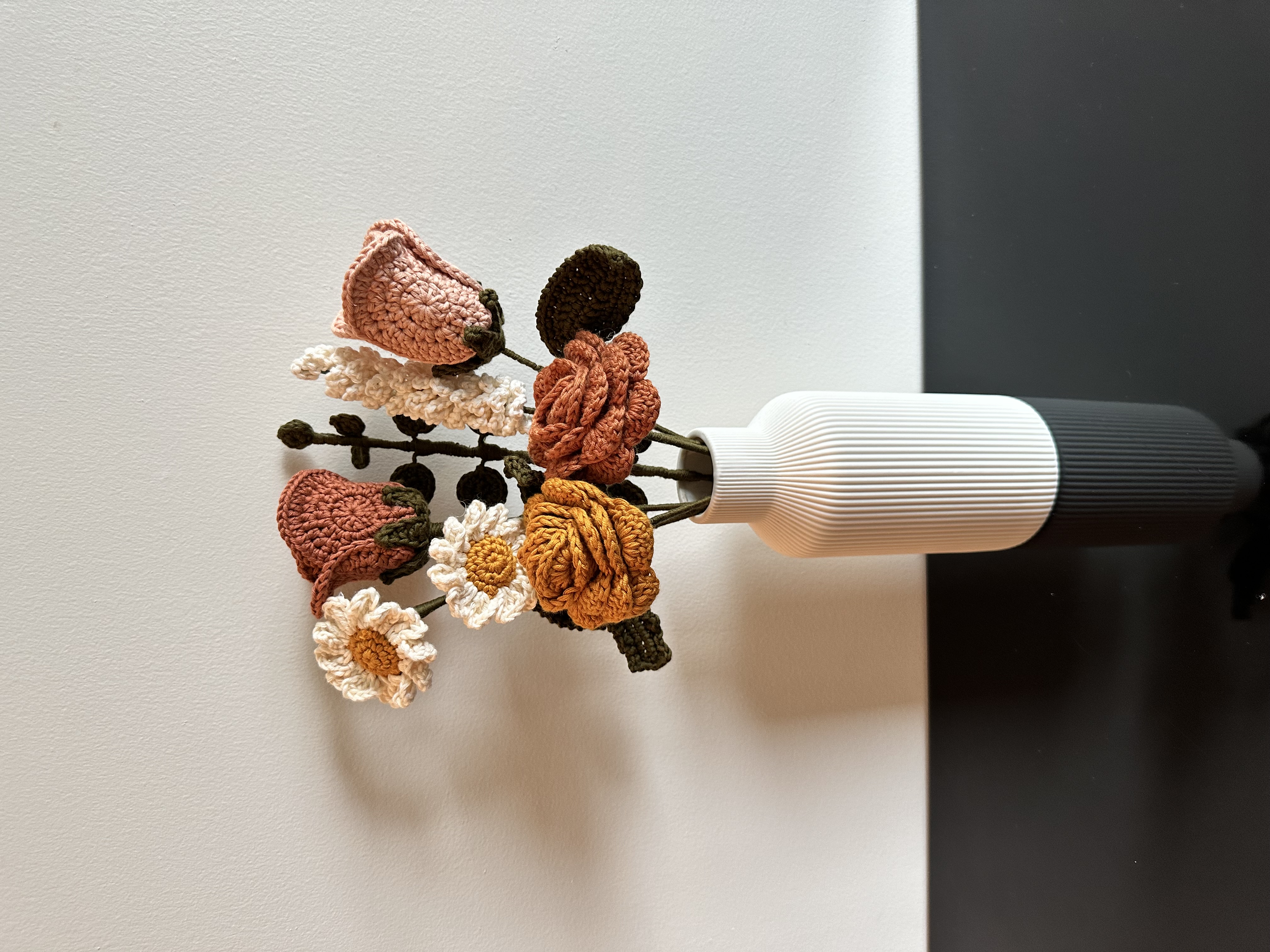 A vase of crochet flowers